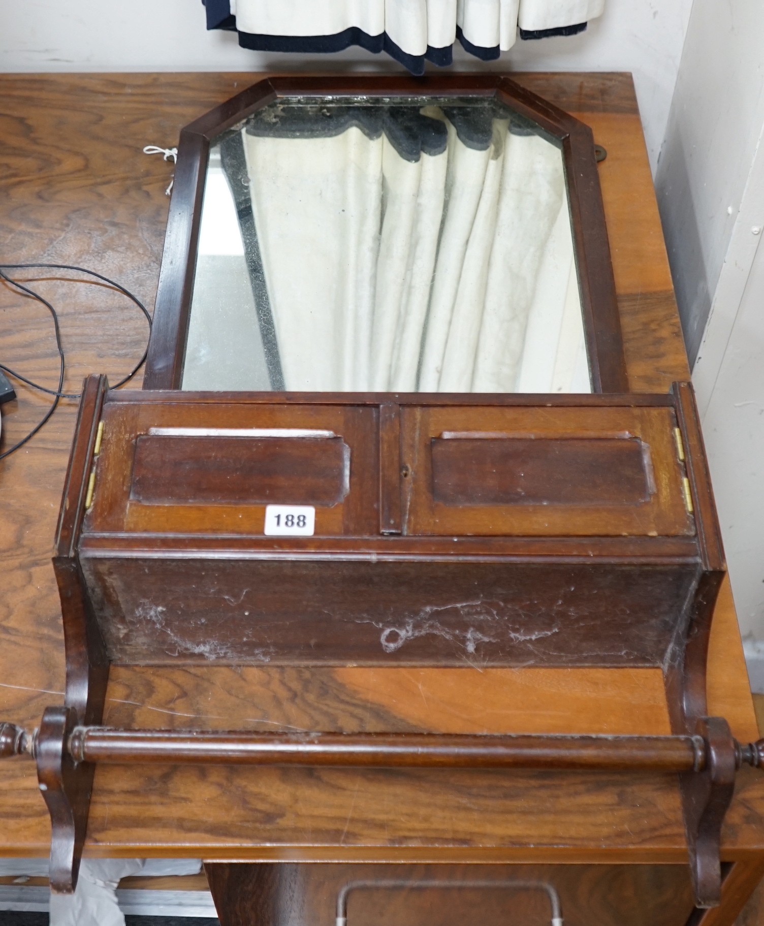 A 19th century German carved oak and beech spinning chair and an Edwardian wall mirror with hanging rail.